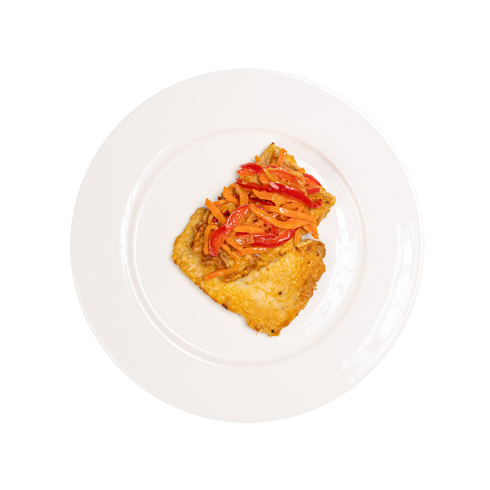 Fried hake with vegetables